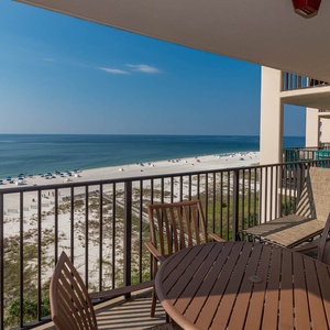 Savor your morning coffee while enjoying stunning views of the beach and clear blue waters