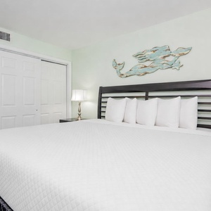 Relax in the king suite where plush pillows and gentle lamp light create a calm retreat after your day on the shore