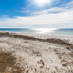 Enjoy breathtaking views of the tranquil water and shoreline from your spacious outdoor area, perfect for relaxation