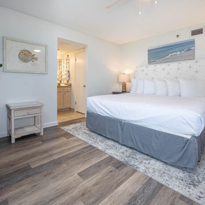 Inviting master bedroom featuring a king bed, stylish decor, and easy access to the master bath
