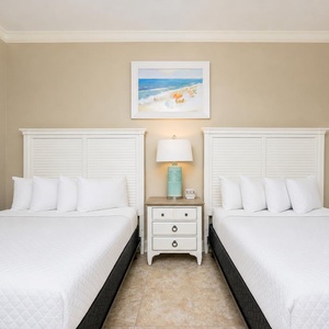Sink into the soft queen bedding in this guest room, perfect for restful nights after beachside adventures