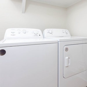 This laundry area features a jetted washer and dryer, providing convenience for guests during their stay
