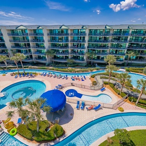Dive into relaxation at the beautiful pool area, where shaded cabanas invite you to unwind under the sun