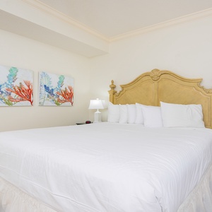 Drift into peaceful slumber on the plush king bed, surrounded by calming decor in this guest suite