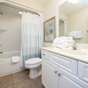 Refresh and prepare for beach adventures in this guest bath, with soft towels at your fingertips for comfort