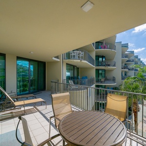 Breathe in the fresh coastal air while lounging on the balcony, taking in serene pool views and relaxing vibes