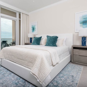 Relax in the king master suite and open the sliding doors to feel gulf breezes from your beachfront balcony