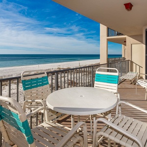 Soak in the serene views of the tranquil water and shoreline from the beachfront balcony