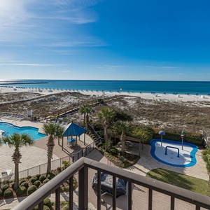 Take in the beach vibes from your balcony, enjoying the scenic poolside view and the soothing sounds of the coast