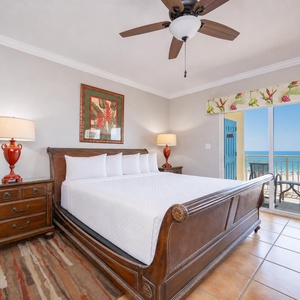 Rest in the master suite with a king bed while coastal breezes drift through your balcony doors