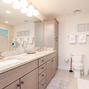 Experience rejuvenation in the master bath, featuring a double vanity, jetted tub, and refreshing walk-in glass shower