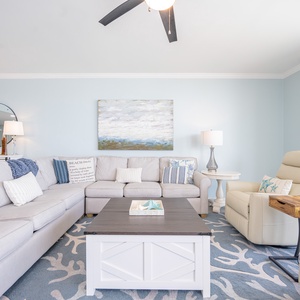 Cool tones and gentle patterns invite you to sink into the sofa in the living room for quiet moments