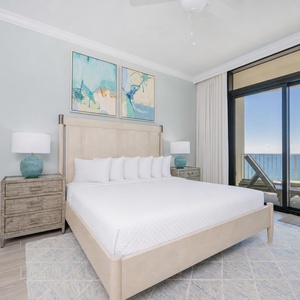 Retreat to the king master suite with fluffy pillows, stylish decor, and stunning beach balcony views