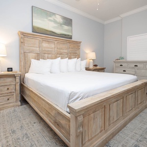 Settle into soft bedding in the master suite with a king bed and unwind after a day at the beach