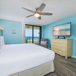 Cool breezes drift through the sliding door as you relax in the master suite with a king bed and coastal views