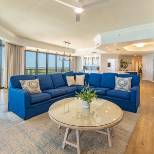 Relax in the plush sectional with queen sleeper, soaking in the coastal vibe as natural light fills the inviting space