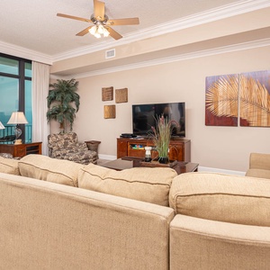 Relax on the cozy sofa with a queen sleeper in this inviting family room with breathtaking beachfront views