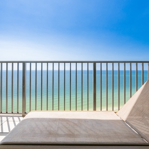 Lounge on the balcony while enjoying impressive views of the tranquil turquoise waters and clear blue sky