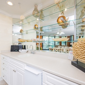 Grab a chilled drink from the fridge or create your favorite cocktail at the wet bar
