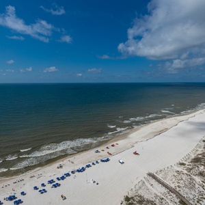 Bask in the warm sun and soothing sounds while lounging on your balcony, taking in beautiful coastal views