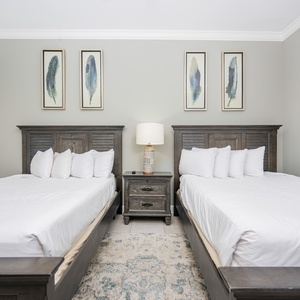 Relax on one of the cozy queen beds in this guest suite and enjoy a peaceful slumber