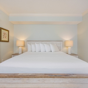 Relax in the soft king bedding, ready to recharge for your coastal adventures of the day