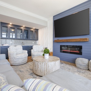 Enjoy quality time in the inviting family room, where comfort meets style, perfect for cozy chats by the fire