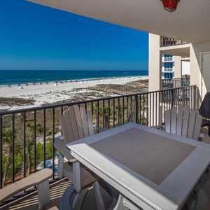 Enjoy the fresh gulf air and stunning views while relaxing on the balcony