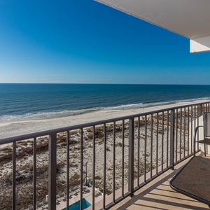 Enjoy stunning beachfront views from the private balcony with comfortable seating for relaxation
