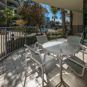 Relax on the balcony as you enjoy the coastal breeze and surrounding lush greenery