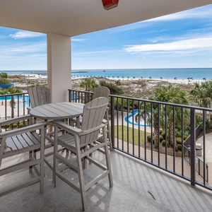 Savor refreshing drinks while lounging at your balcony, taking in the beach vibes and lovely coastal views
