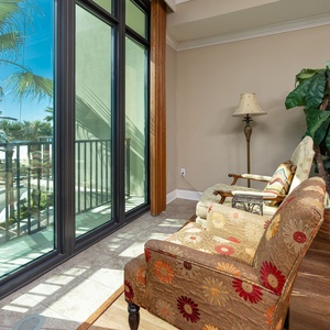 Nestle into the plush seating and enjoy your favorite book while basking in natural light from the balcony