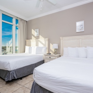 Relax in soft, queen bedding in this guest suite while sunlight streams in, inviting you to enjoy beautiful coast views