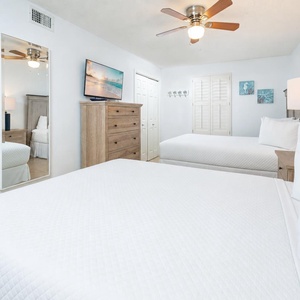 Drift into relaxation on the cozy queen beds, where soft linens promise restful nights and peaceful mornings