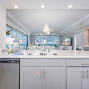 Prepare meals in this kitchen with elegant cabinetry, upgraded appliances, and spacious countertops