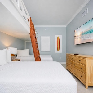 Experience comfort in this loft bunk room featuring two double beds, a cozy double loft, and a large TV