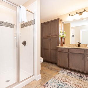 Indulge in rejuvenating showers in this guest bathroom, where thoughtful details enhance your retreat experience