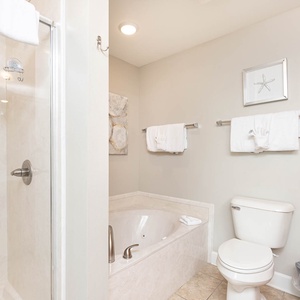 Indulge in relaxation with a jetted tub and a spacious walk-in shower in this inviting master bath