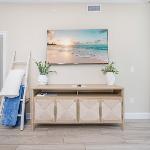 Enjoy the serene atmosphere with a stylish TV and decorative accents, perfect for relaxing after a day of fun