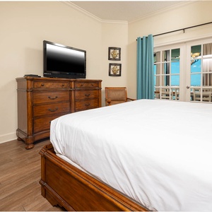 Relax after a fun beach day and enjoy a movie from the cozy king bed in the master suite