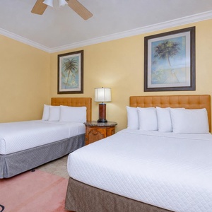 In the guest suite with double beds, rest and drift into peaceful sleep after a day exploring the coast