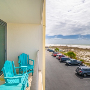 Unwind in your vibrant chairs on your balcony, while enjoying the calming views of the coast and beach vibes below