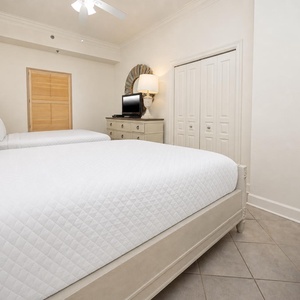 Unwind in this queen guest suite and stream your favorite shows or enjoy a good movie after a beach day