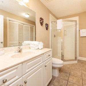 Refresh in this additional guest bath with a walk-in shower and laundry area with a washer and dryer in your rental