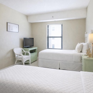 Relax after a day at the beach in this guest room with two cozy twin beds