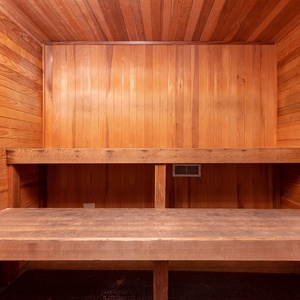 Relax in this serene sauna with warm wood finishes, perfect for unwinding on your vacation after a workout in the gym