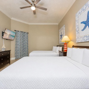 Rest in the comfort of plush queen beds while enjoying the soothing decor that invites restful nights on your beach getaway