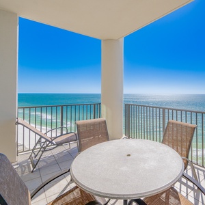 Experience astonishing views from the balcony, complete with a round table and comfortable seating for relaxation