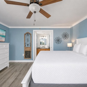 Soft linens dress the king bed in the master suite where you watch a good movie and relax