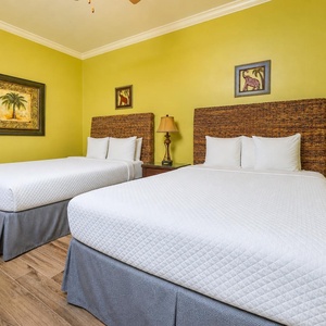 In the guest suite with two queen beds, you'll settle in for shared stories and restful nights